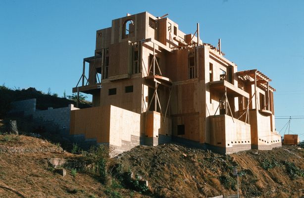 3-Story newly designed house under construction with framing sheathed in plywood in Oakland, CA