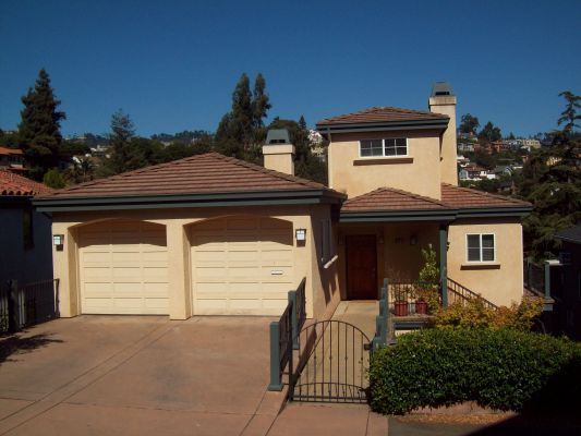 Completed hillside home replacing house in high fire district that was lost in the Oakland Firestorm