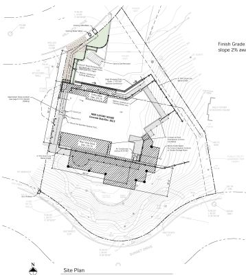 Site plan indicating location of main structure, large rear deck & retaining wall on hillside topography
