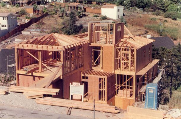 Framing in progress of hillside home designed by Robert Meckauer replacing house lost in Oakland Firestorm